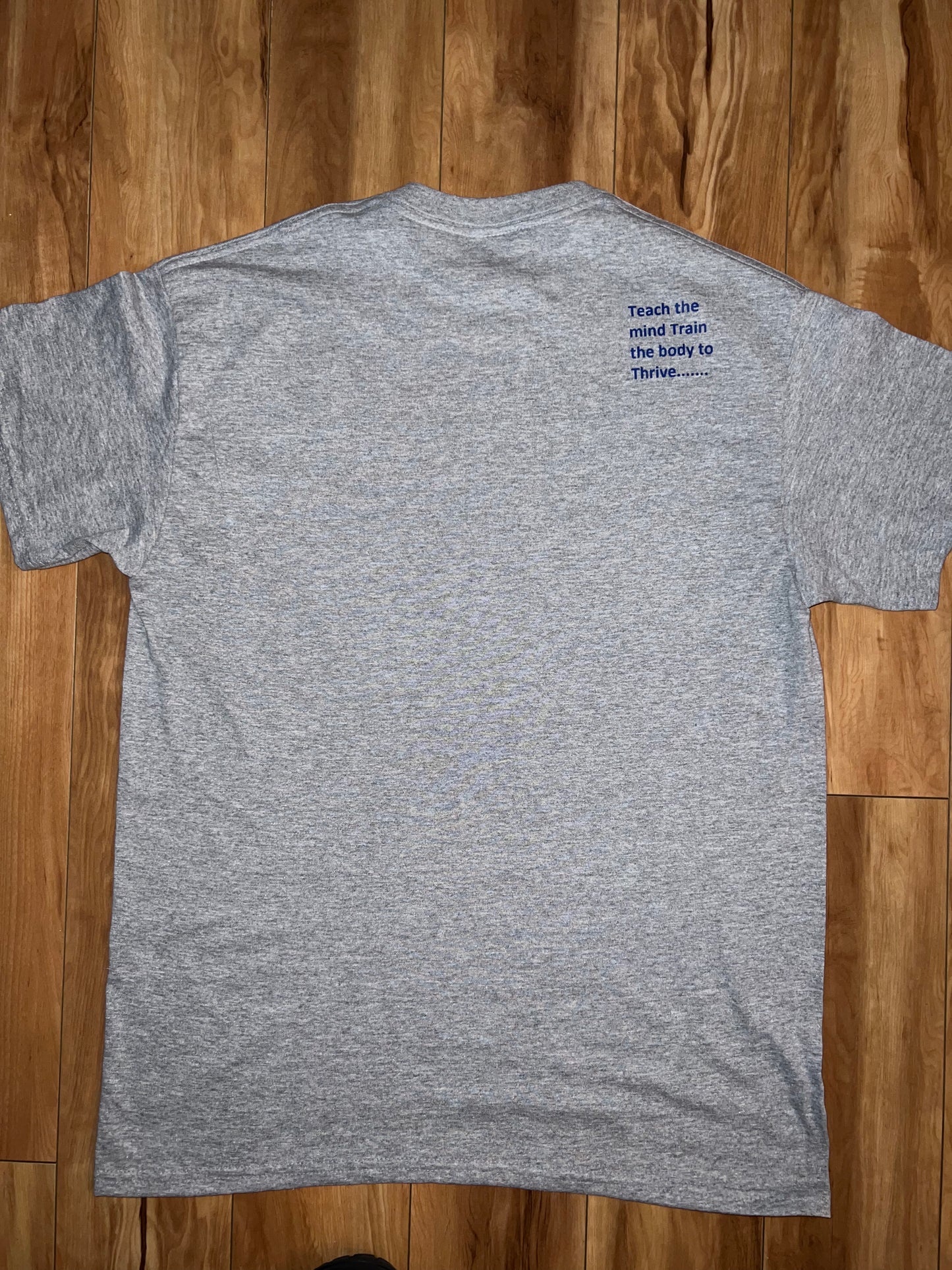 Grey T-shirts with our teach-train-thrive logo